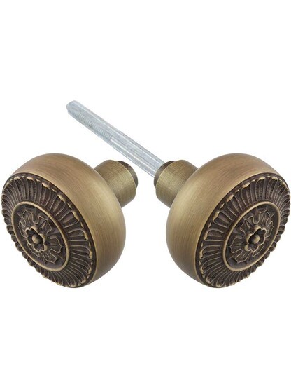 Pair of Cast-Brass Pisano Door Knobs in Antique Brass.